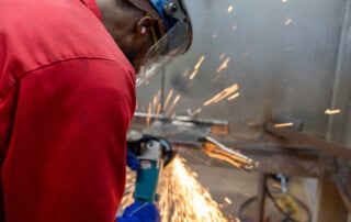 Student earning income in paid welder training program