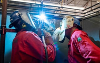 Student receiving on the job welding training